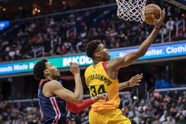 Giannis Antetokounmpo of the Milwaukee Bucks goes to the basket against Otto Porter Jr. of the Washington Wizards during the second half at Capital One Arena in D.C. on Feb. 2. (Scott Taetsch/Getty Images)