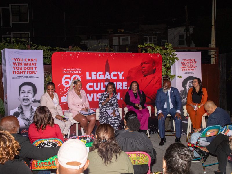 Panelists Chinyere Hubbard, Kathy Guzman, Denise Rolark Barnes, Courtney Edmonds, Corey Arnez Griffin, and Tonya Poindexter seated on stage at the WIN Exhibit Reception.