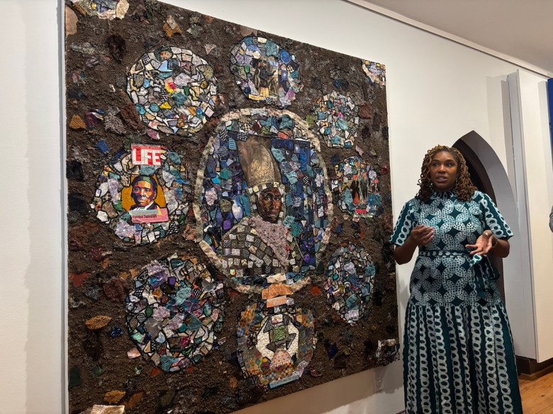 Curator of Collections and Exhibitions Martina Dodd invites guests to explore the unique details of a revered Harriet Tubman portrait on Feb. 8. The artwork serves as a tribute to the abolitionist’s legacy and Maryland roots, comprising pieces of literature, thrifted clothing, and soil derived from different parts of the state. (Jada Ingleton/The Washington Informer)