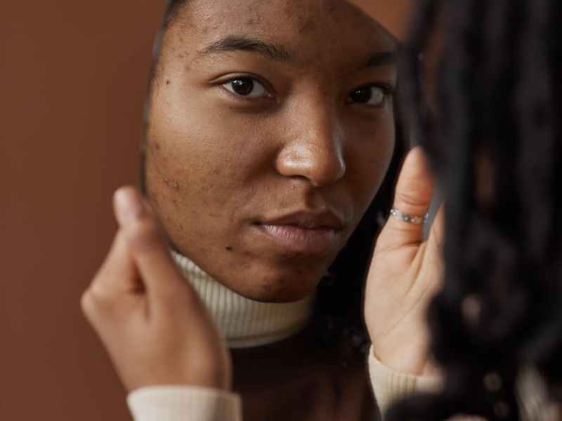 reflection of a woman on a mirror