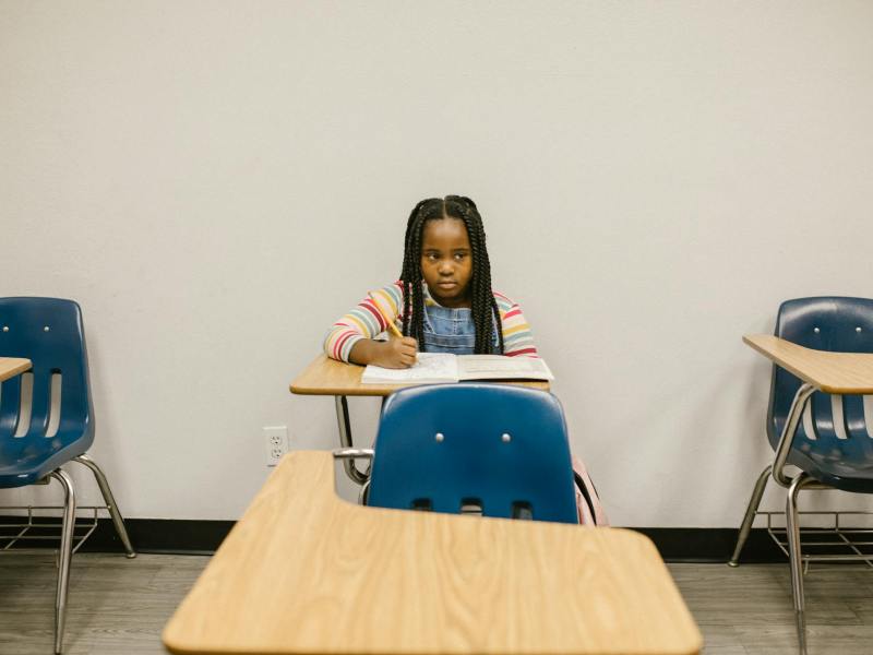 girl sitting on her desk