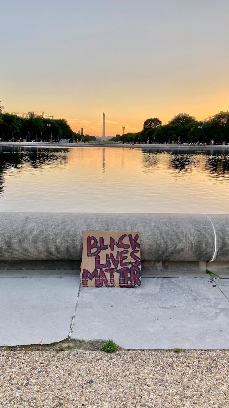 photo of a brown cardboard sign with texts