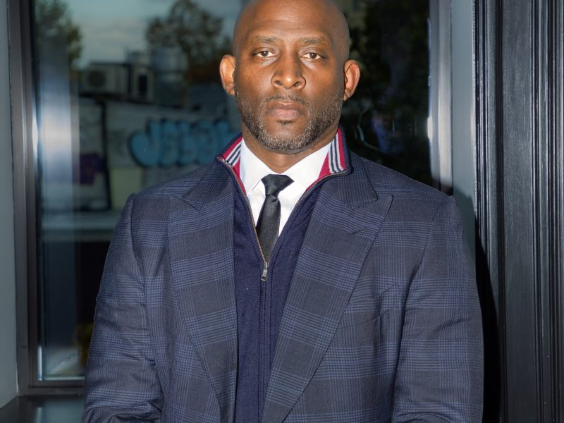 A portrait of Thomas Penny, President of Donohoe Hospitality, standing indoors near a window before the Real Safety D.C. roundtable.
